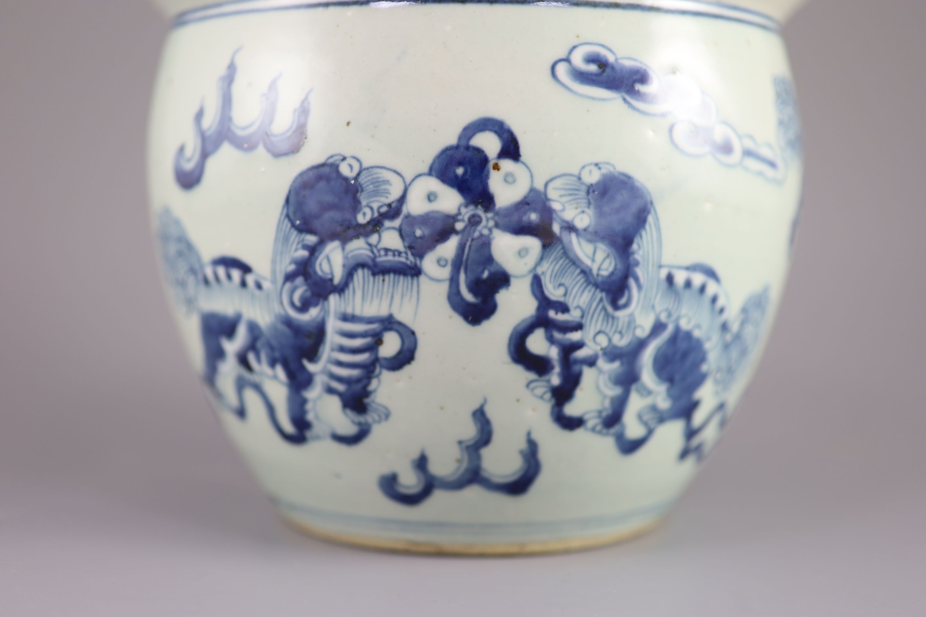 A Chinese blue and white 'lion-dog' flower pot, 20cm diameter